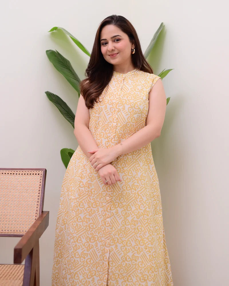 A sleeveless, knee-length kurti featuring a band collar and a full button-down placket.