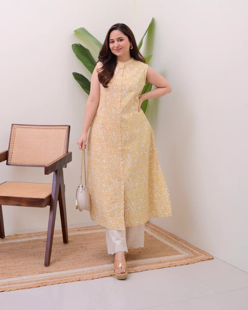 A sleeveless, knee-length kurti featuring a band collar and a full button-down placket.