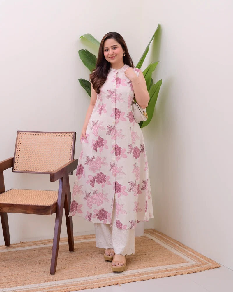 A sleeveless, knee-length kurti featuring a band collar and a full button-down placket.